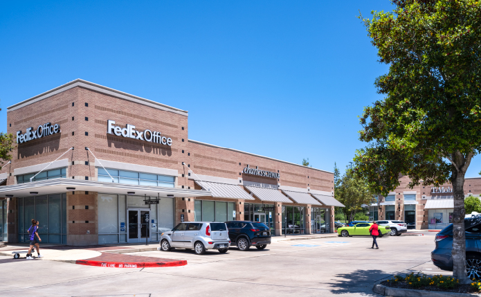FedEx Office, Charles Schwab and small shops at Lake Pointe Village in Sugar Land, TX