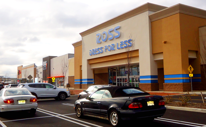 Cars parked in parking lot at entrance to Ross Dress for Less at Collegetown Shopping Center