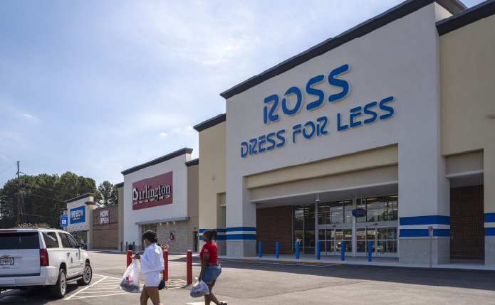 Patrons with bags exiting Ross Dress for Less store.