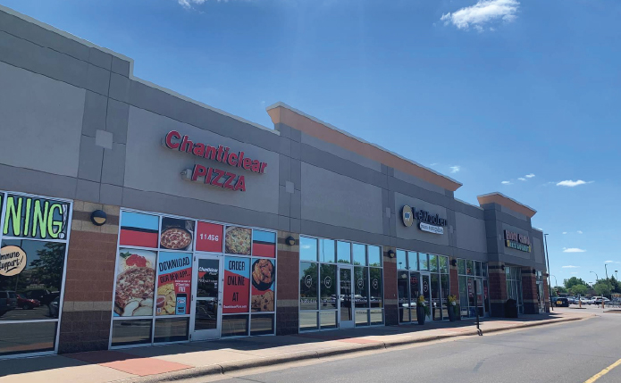 Small shop building at retail shopping center Champlin Marketplace