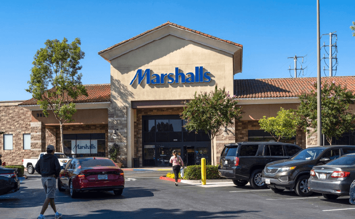 Customers approach Marshalls store through tree-lined parking lot.