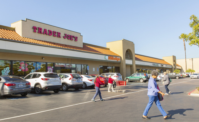 Customers crossing road in front of Trader Joe's