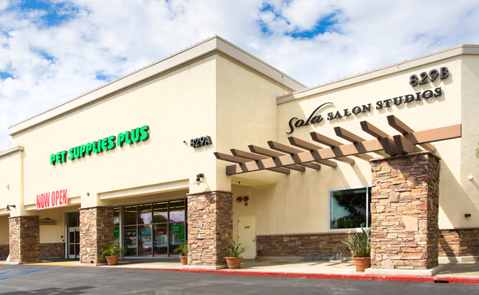 Pet Supplies Plus and Sola Salon storefronts in Brixmor retail shopping center