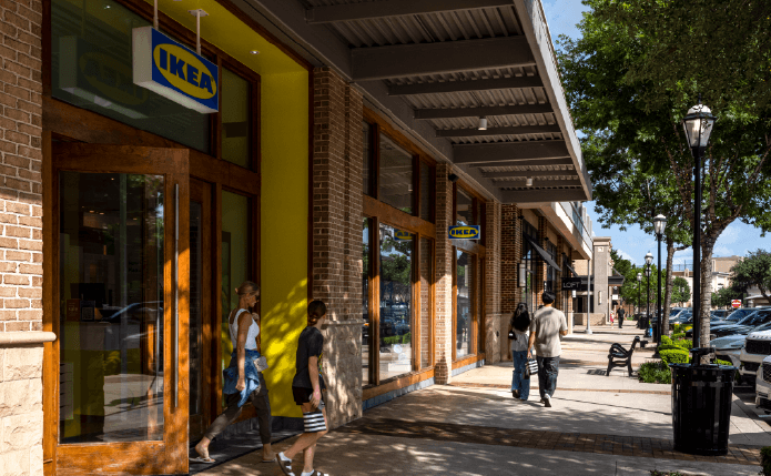 Patrons on sidewalk in front of Ikea store.