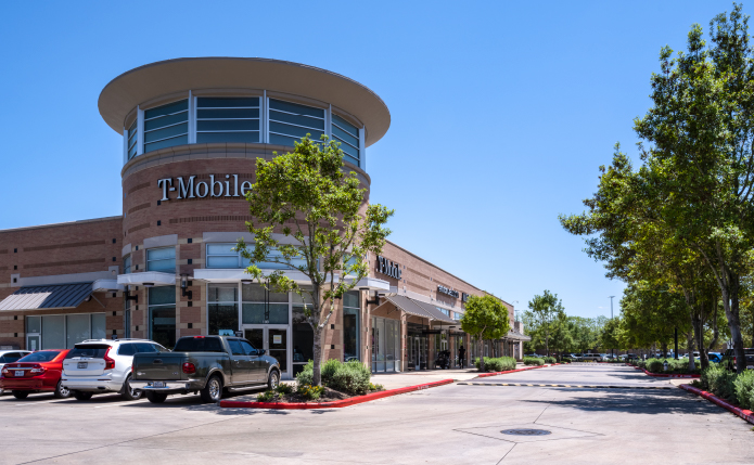 T-Mobile and small shops at Lake Pointe Village in Sugar Land, TX