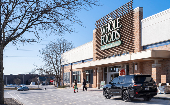 Whole Foods grocery store at retail shopping center Ravinia Plaza in Orland Park, IL; completed acquisition
