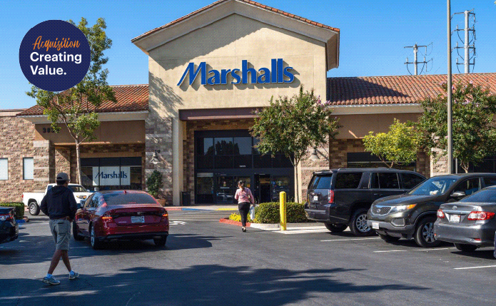 Customers approach Marshalls through tree-line parking lot.