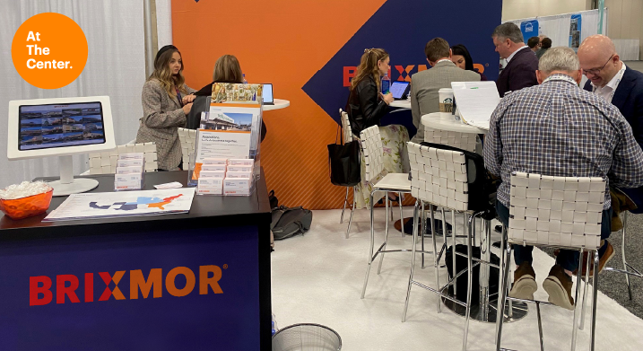 Brixmor booth at Red River ICSC with people seated at tables.