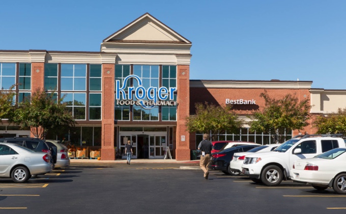 Kroger supermarket with customer approaching from the parking lot