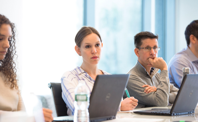 Brixmor employees in front of their computers at a development training program