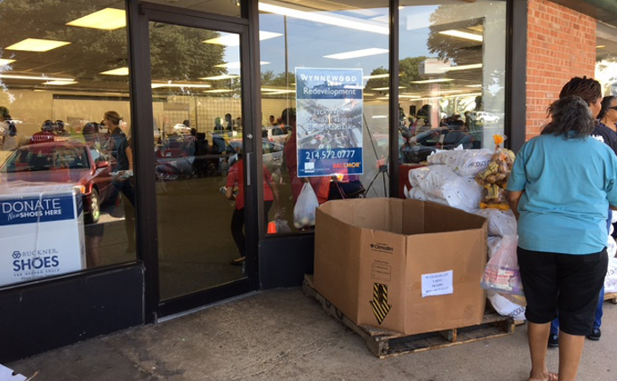 donation boxes next to entrance of storefront