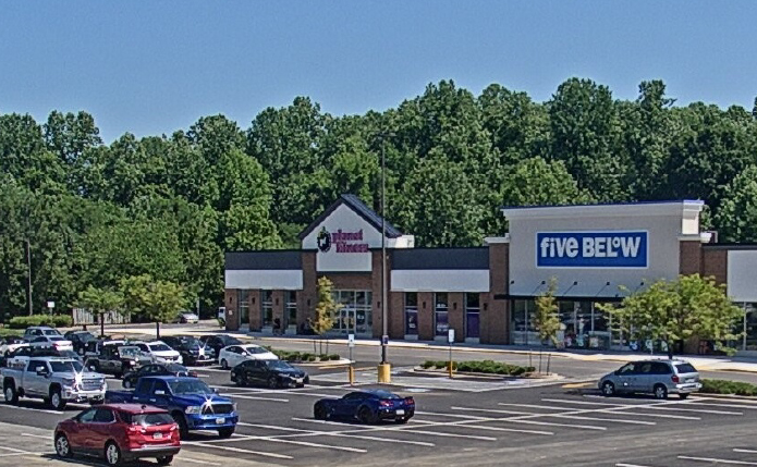 Parking lot view of Five Below and Planet Fitness.