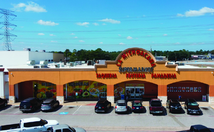 La Michoacana Supermarket and parking lot from aerial view.