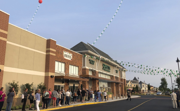 Line of people outside Sprouts Farmers Market at Marlton Crossing shopping center
