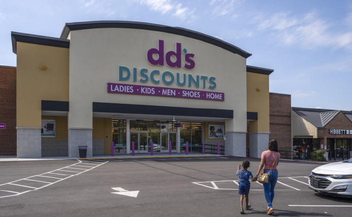 Woman and child approach dd's Discount store.