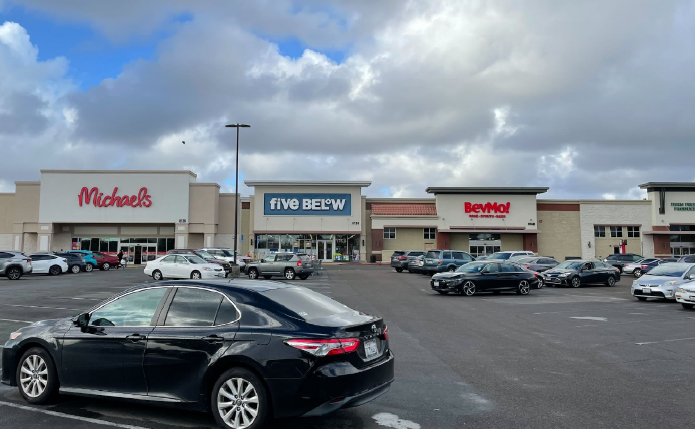 Busy parking lot in front of Michael's, Five Below and BevMo!