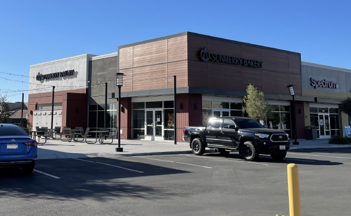 Sunmerry Bakery with truck and outdoor seating outside.