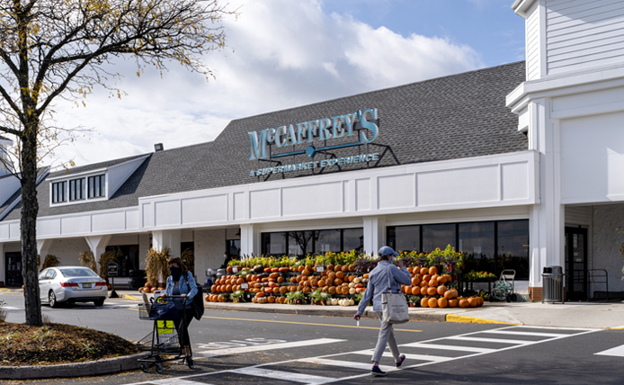 Pumpkin display in front of McCaffrey's Grocer entrance at Village at Newtown shopping center