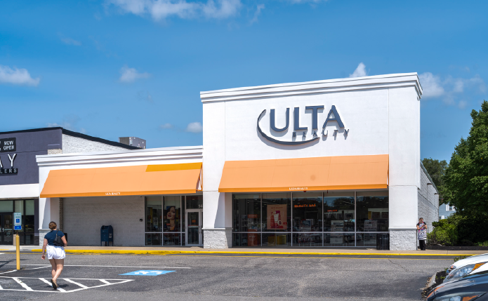 Ulta storefront with woman approaching on the left.