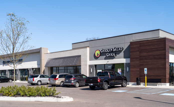 Cars parked along exterior of Chicken Salad Chick at Western Hills Plaza shopping center