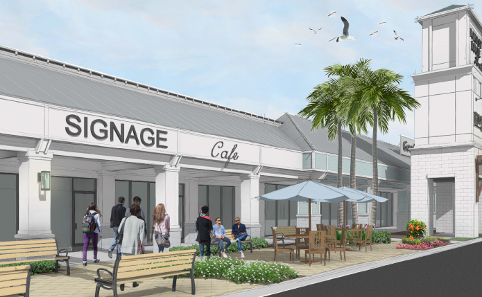 Benches, greenery and umbrellas at exterior of small shops at outdoor shopping center in Port St. Lucie, Florida 