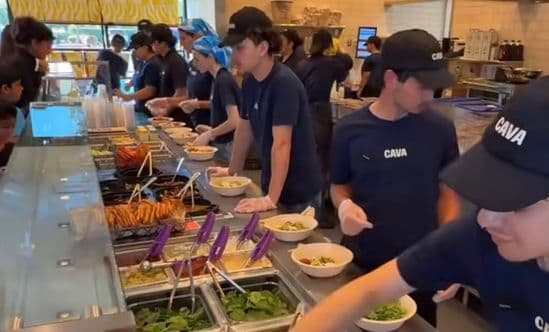 line of workers at CAVA making food