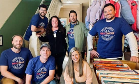 Six people from Accounting team looking forward during Brixmor's Day of Service