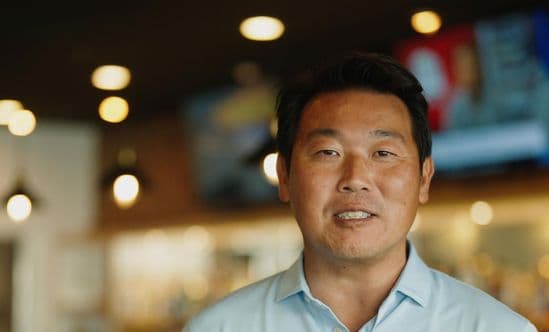 Oishi restaurant owner John Im inside his restaurant