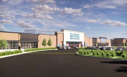 Rendering of Ross Dress for Less at Tinley Park Plaza in Tinley Park, IL, featuring a modernized façade with tan and white architectural elements, blue accent panels, landscaped walkways, and adjacent inline retail spaces set behind a large parking field under a partly cloudy sky.