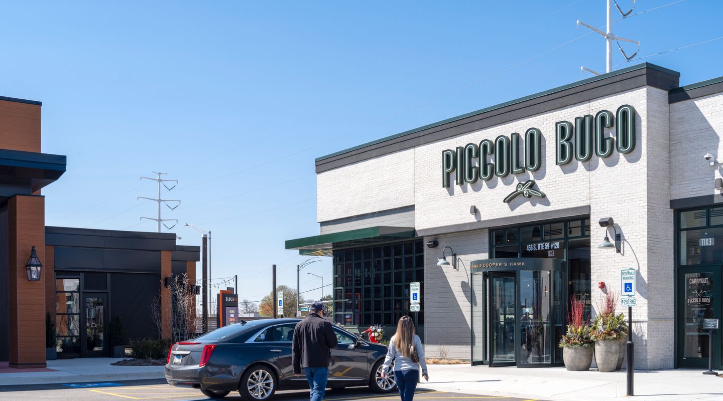 Piccolo Buco restaurant at Block 59 in Naperville, IL highlighting repositioned retail space, refreshed façades, and walkable site design as part of the completed mixed‑use redevelopment.