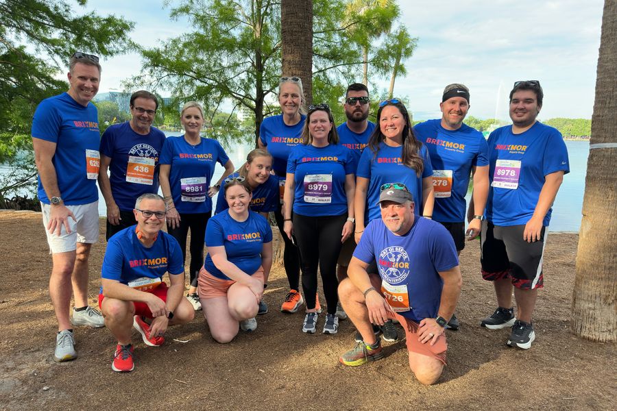 Group of employees in Brixmor shirts at a Corporate Challenge fitness event in Orlando