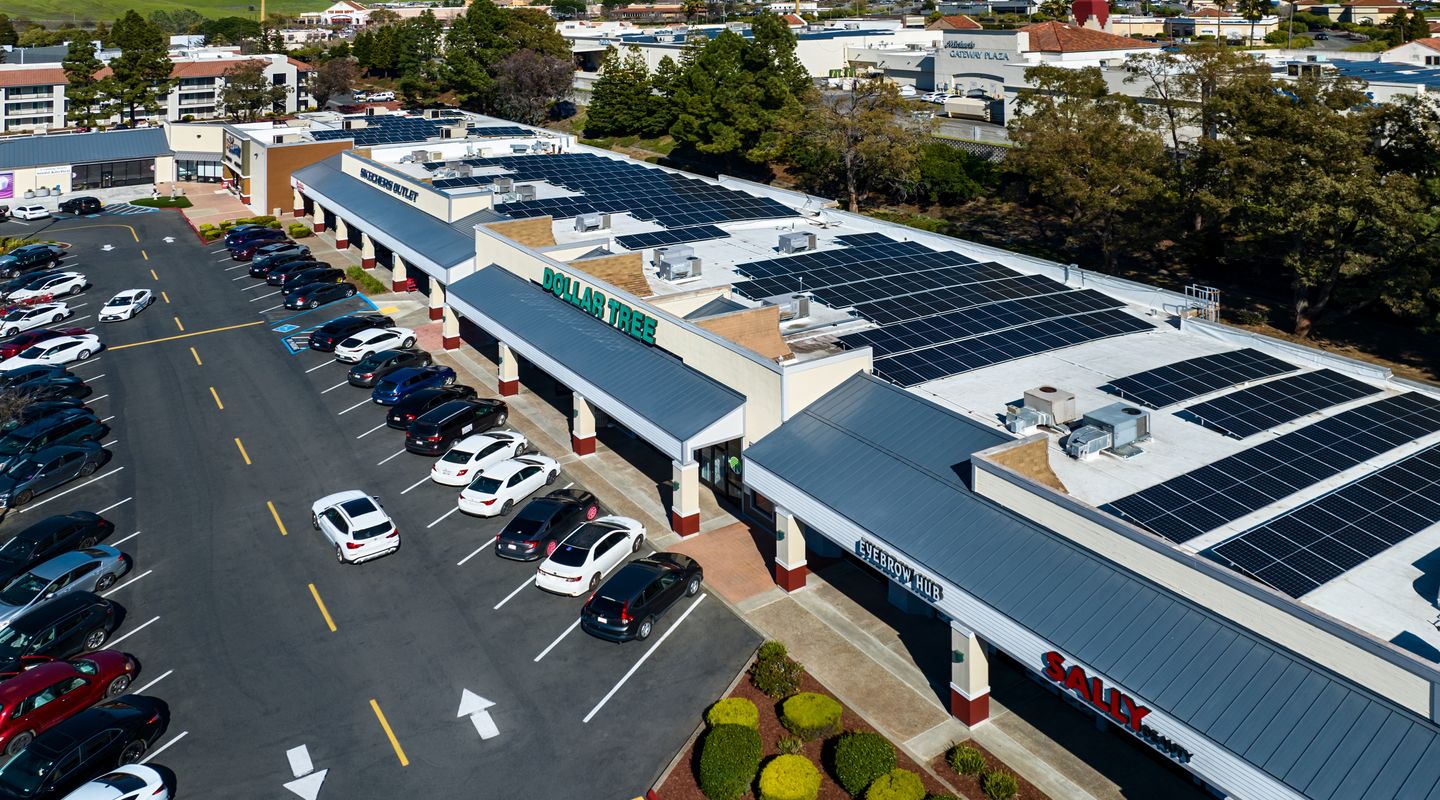 Close up horizontal view of solar panels on the roof of an open air center Vallejo Corners in Vallejo, CA