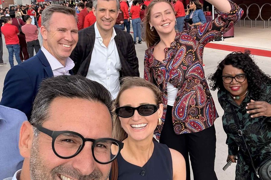 Selfie photo of six people on a team outside of Target store opening